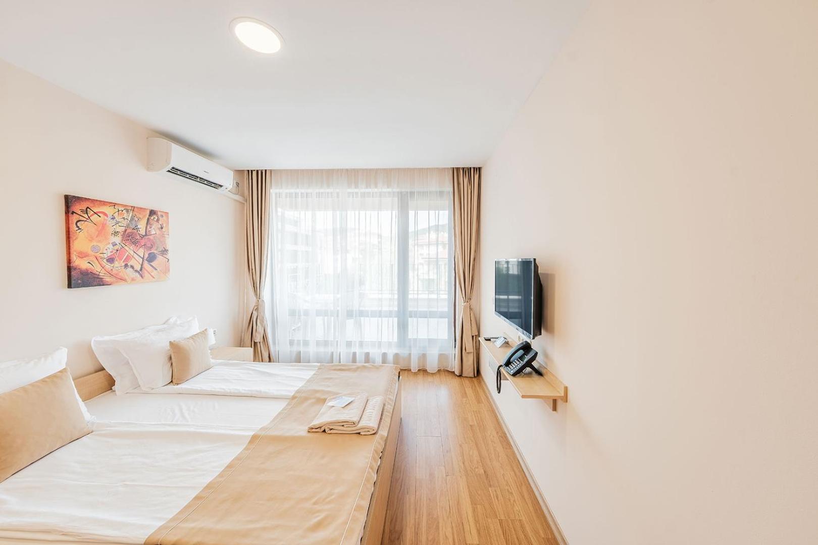 One-Bedroom Apartment with Balcony (2 Adults + 2 Children)